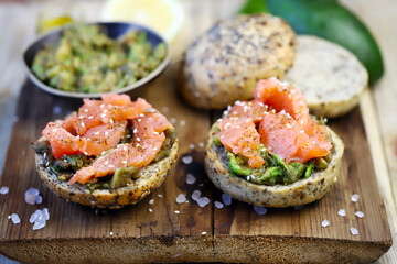 Salmon avocado sandwiches on buns with seeds. The keto diet. Healthy breakfast or snack.