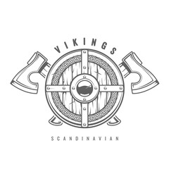 Round Viking shield with crossed axes and celtic pattern, medieval wooden armor with hatchets, old shield decorated with scandinavian ornament