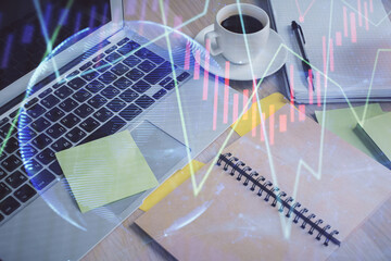 Multi exposure of forex graph drawing and desktop with coffee and items on table background. Concept of financial market trading