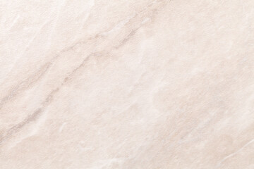 Fototapeta na wymiar Texture of light beige marble with brown lines of a pattern, macro background.