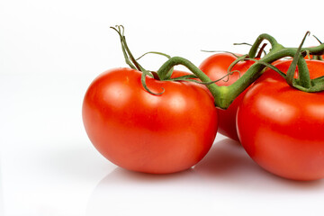 a bunch of large tomatoes on a white background