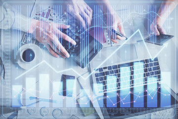 Double exposure of man and woman working together and financial chart hologram drawing. market analysis concept. Computer background. Top View.