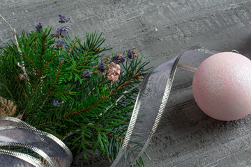 beautiful christmas decor in silvery tones, christmas bouquet, christmas toys on a concrete...