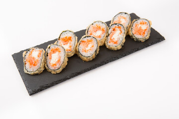 Japanese seafood sushi, roll on shale food board on white background