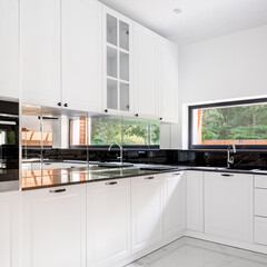 Classic white kitchen with window