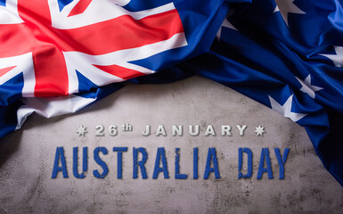 Fototapeta na wymiar Happy Australia day concept. Australian flag against old stone background. 26 January.