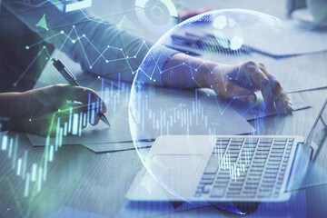 Double exposure of businesswoman hands typing on computer and forex chart hologram drawing. Financial analysis concept.