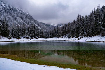 Green lake Gruner see cloudy winter day. Famous tourist destination in Styria region, Austria