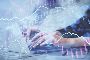 Multi exposure of woman hands typing on computer and financial graph hologram drawing. Stock market analysis concept.