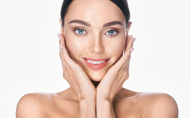 Concept of face lifting skin. Brunette woman with smooth fresh skin, smiling at the camera, on...