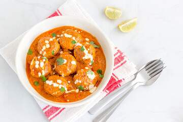 Butter Chicken Meatballs in White Bowl with Cilantro and Lemon, Indian Food Photography