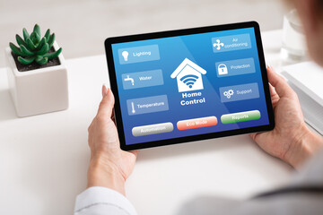 Smart House Control. Unrecognizable Woman Using Digital Tablet With Home Automation System