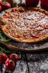 Italian pizza on wooden board