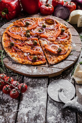 Italian pizza on wooden board