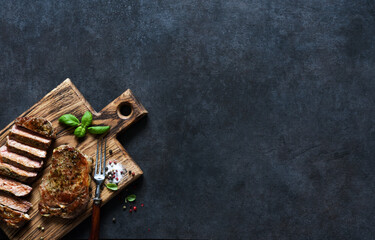 Grilled beef steak with herbs and spices. Top view with space to copy text