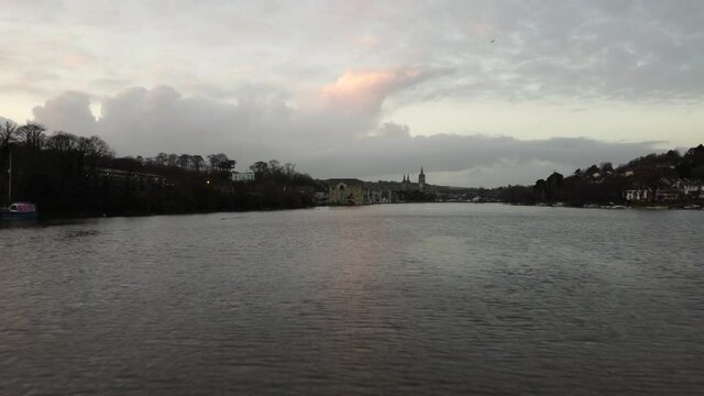 fly up the Truro river towards the cathedral at dusk cornwall England uk aerial drone 
