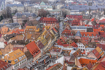 Fototapeta na wymiar Aerial view of Strasbourg old city with red roof tiles. France. Strasbourg is the capital and principal city of Alsace region in eastern France and is official seat of European Parliament.