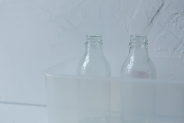 STELKED bottles on a light background, garbage sorting rules, dark bottle, light