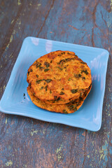Delicious Indian Masala Puri or Methi Puri. Indian Bread Made of fenugreek leaves.