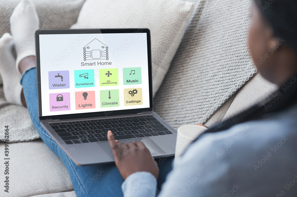 Poster African Lady Using Laptop With Smart Home Control System Interface On Screen
