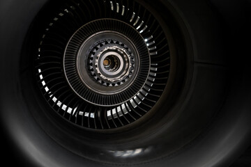 Details of the turboprop engine. Airplane propeller. Turbine mechanism and device. Screws, nuts, the inside of the device. Metallic background. Postcard for a mechanic engineer. Blade and blades.