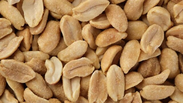 salted roasted peanuts top view. snack to beer