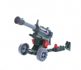 toy artillery cannon, fires plastic shells. isolated on white background.