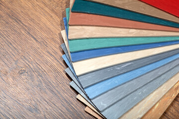 Samples of linoleum in different colors and designs for flooring in rooms and houses. Interior design and finishing materials