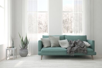 Fototapeta premium White living room with sofa and winter landscape in window. Scandinavian interior design. 3D illustration