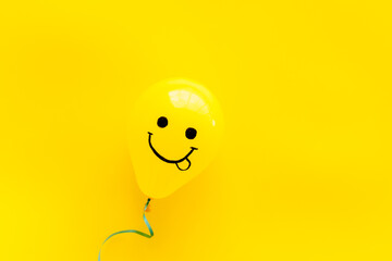 Happiness emotions painted on ballon. Positive mood background. Top view