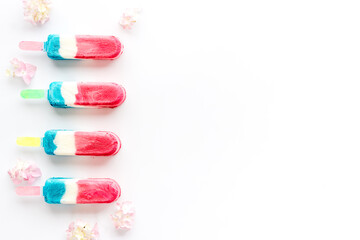 Pattern of ice cream on sticks. Colorful popsicle, top view