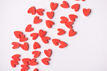 Photo of abstract background of red cute lovely hearts isolated on white