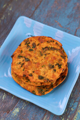 Delicious Indian Masala Puri or Methi Puri. Indian Bread Made of fenugreek leaves.