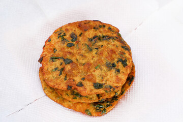 Delicious Indian Masala Puri or Methi Puri. Indian Bread Made of fenugreek leaves.
