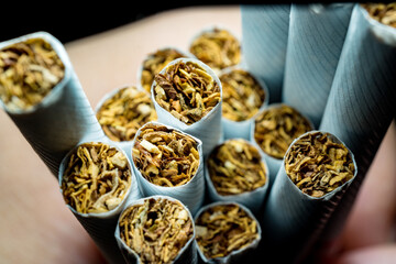 A pack of white cigarettes photographed close-up