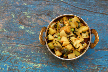 Indian recipe, mixed veg containing potato, Pea, CAULIFLOWER and Eggplant.