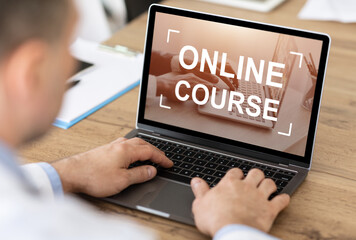 Caucasian businessman having online course, office interior