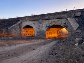 Fototapete Landwasserviadukt country road through two tunnels under railways