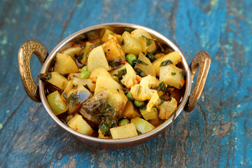 Indian recipe, mixed veg containing potato, Pea, CAULIFLOWER and Eggplant.