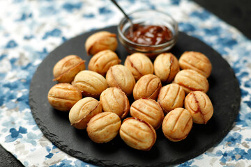 Nuts cakes with boiled condensed milk. National sweets of Russia.