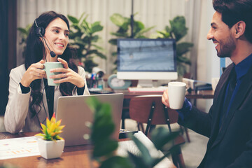 Team Call center and customer service team support for information operator at work.  People woman and man employee consultant talking and relax after help and service customer.