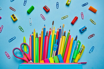 School background. Pencil case with bright office supplies