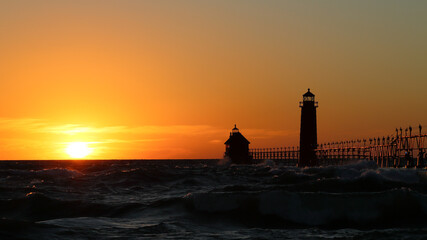 Fototapeta na wymiar Grand Haven South Pier Lighthouse at sunset
