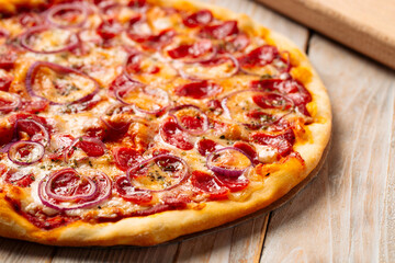 Closeup on hunter's sausage pizza on the wooden rustic table