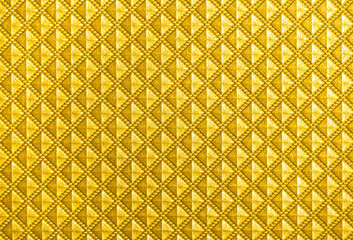 Illuminating color of the year 2021. Vintage background with small symmetrical yellow rhombus.