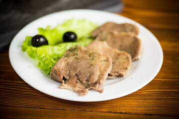 boiled beef tongue sliced in a plate