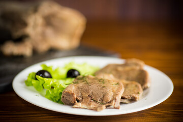 boiled beef tongue sliced in a plate