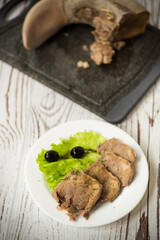 boiled beef tongue sliced in a plate