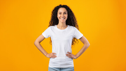 Cheerful Woman Standing Holding Hands On Hips, Studio Shot, Panorama