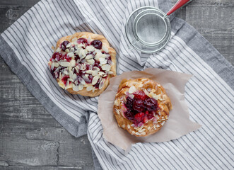 
Sweet pastries with berries on a light background.